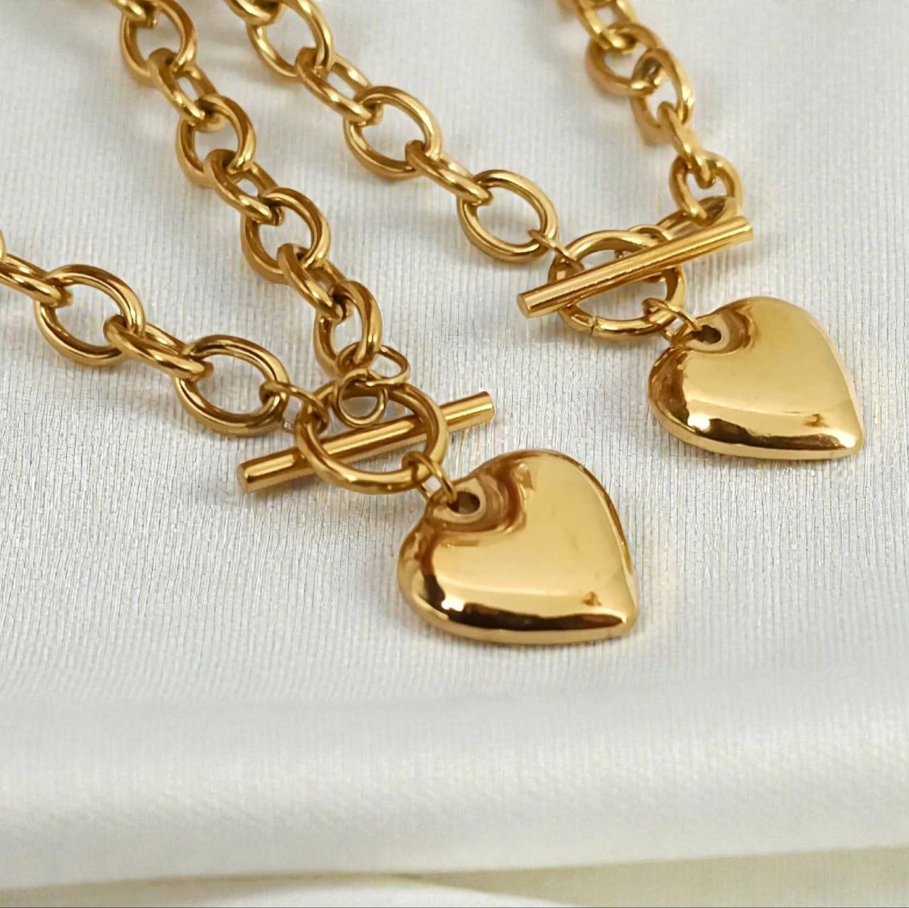 Gold chain necklaces with heart charms and OT toggle clasp
